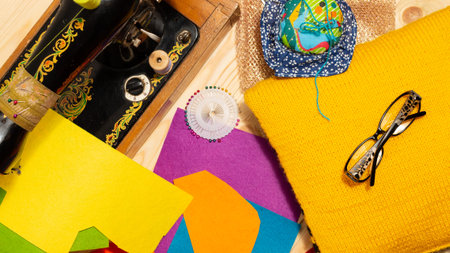 Sewing on a sewing machine design. Making objects with your own hands. Multicolored threads and...