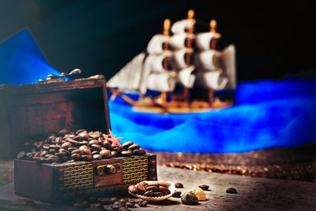 Image of middle-aged coffee beans. Poured into a pirate chest. Precious, expensive, tonic,...