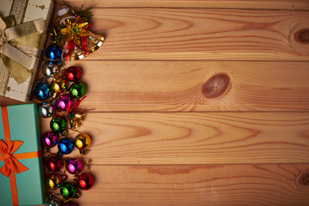 On a wooden background Christmas story. Christmas colorful toys and balls.On a light background...