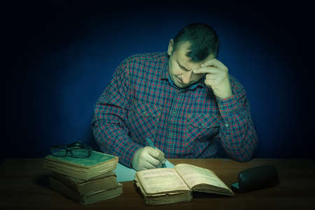 The man reads the book. In the head images similar to reality are born. Fascinating literary work. The author very well wrote the novel. The best-seller for all times. Imperishable literature.の写真素材