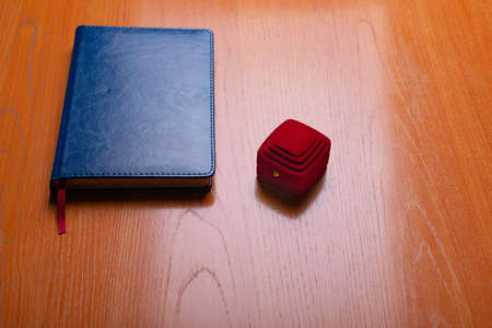 The notebook of blue color on office table. Tie men's cyanogen of color. A background for the business card. A notebook for idea business. の写真素材