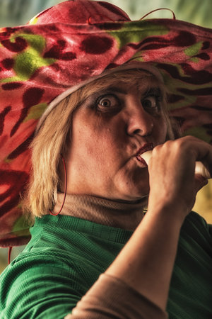 Portrait of an elderly woman with a scarf on her head.の写真素材