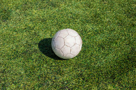 Soccer ball on a green lawn. Sports Equipment.の写真素材