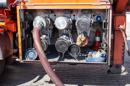 A tanker refuel at a gas station. Fuel truck lowers gasoline.の写真素材