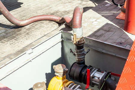 A tanker refuel at a gas station. Fuel truck lowers gasoline.の写真素材