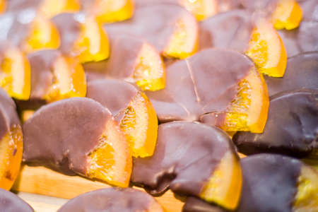 Chocolate coated orange. A treat for tea.の写真素材