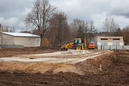 Start building a house. Construction site to create the foundation of the building. Hard work at a...