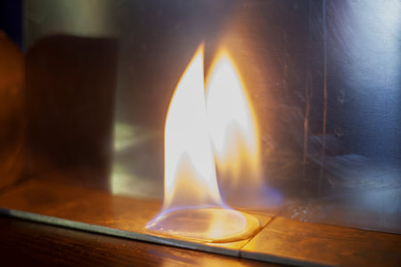 Tongue of fire flame in the dark. Ignition of oxygen in space. Fiery background. Fire of ether in...