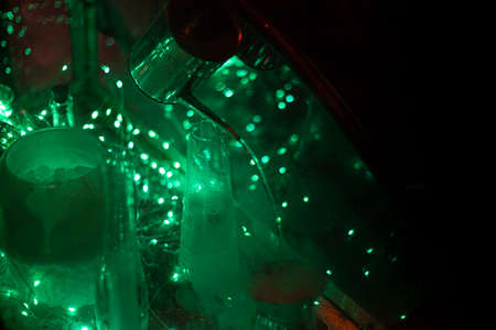 Neon glow of laboratory tools. Cyber punk plot. Box with miracles. Smoke from dry ice inside the box. Transparent box with devices for alchemy. Fantasy production.の写真素材
