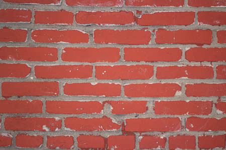 Red brick wall. Brickwork. The texture of the stone. Construction material. Building a wall of blocks and cement. Simple industrial background.の写真素材