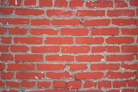 Red brick wall. Brickwork. The texture of the stone. Construction material. Building a wall of blocks and cement. Simple industrial background.の写真素材