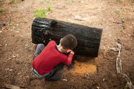 A boy is playing on the street. A child on a walk. Child rest on a summer day.の写真素材