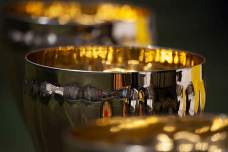 Golden football cup. Sports award. A big cup for victories. The football competition ended with a prize.の写真素材