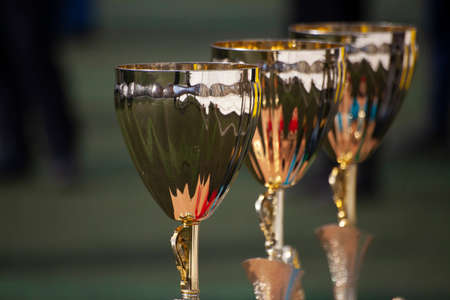 Golden football cup. Sports award. A big cup for victories. The football competition ended with a prize.の写真素材