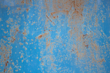 Rusty background. Poorly painted surface. The texture of the old metal structure. Simple background...