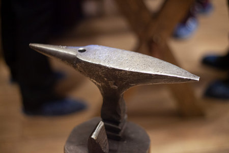 Anvil for forging metal. Iron item. Vintage background on the theme of metal processing. Tool in the...