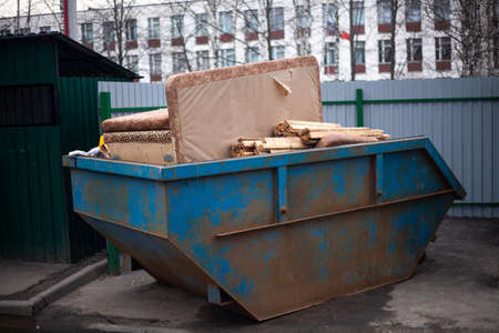 Trash bin on the street. Capacity for discarded items. Garbage collection in the city. A special place for waste. District Utility Serviceの写真素材