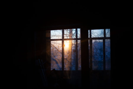 Light in the window in the morning. Background awakening at dawn. Window frames are photographed as...
