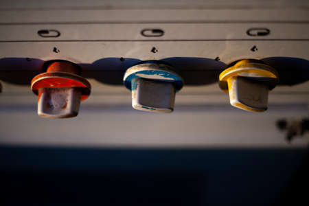 Old gas stove in the kitchen. Knobs for adjusting the gas supply. Morning light falls on a vintage fire plate.の写真素材