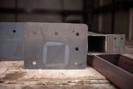 Steel beams in stock. Metal products in the workshop. The metal is prepared for loading. Industrial steelmaking.の写真素材