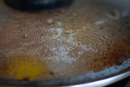 Eggs are fried in a pan. Delicious food is prepared for breakfast. Event in the kitchen. A gas stove heats the dish. Normal human nutrition.の写真素材