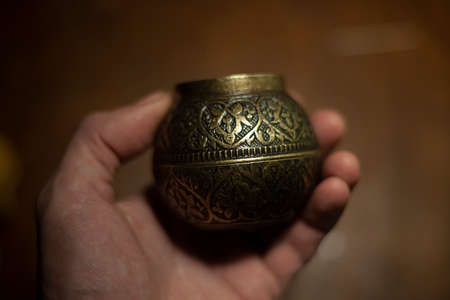 Antique water bowl. Forged metal object. Decoration for the table. Patterns on the vessel.の写真素材