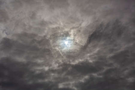 Dramatic sky. Gray clouds. Cold weather front. Low autumn sky. The beauty of the air masses. Natural background of gray rainy clouds.の写真素材