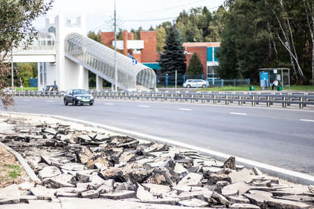 Road repair. Pedestrian zone. Road construction. Broken asphalt. Shooting on a sunny day. Highway reconstruction work.の写真素材