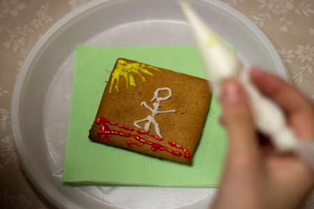 Gingerbread cookie with icing. Homemade baking. A festive treat. Sweetness for tea. Tasty food. Glaze homemade cookies.の写真素材