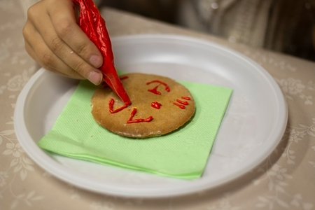 Gingerbread cookie with icing. Homemade baking. A festive treat. Sweetness for tea. Tasty food....