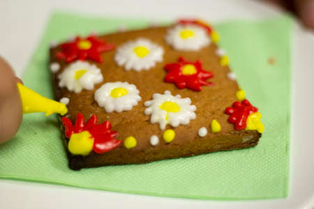 Gingerbread cookie with icing. Homemade baking. A festive treat. Sweetness for tea. Tasty food. Glaze homemade cookies.の写真素材