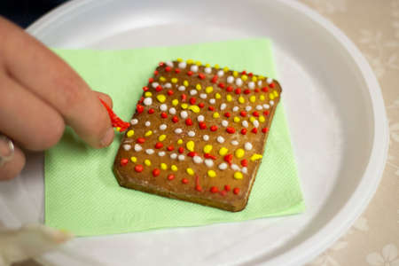 Gingerbread cookie with icing. Homemade baking. A festive treat. Sweetness for tea. Tasty food. Glaze homemade cookies.の写真素材