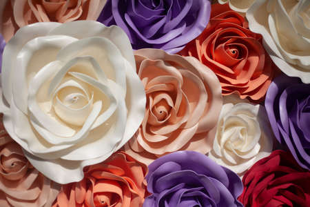 Background from flowers. Large flowers of different colors. The texture of the petals. Handcrafted plastic background.の写真素材