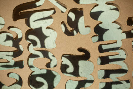 Waste after milling. A hole carved out of wood. Cuts in the board. Background from a leaky wooden canvas.の写真素材