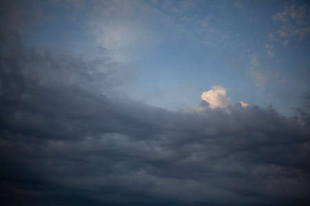 Heavenly landscape. Evening clouds. Beauty of nature. Gloomy sky background. Tragic notes in nature. It gets dark outside.の写真素材