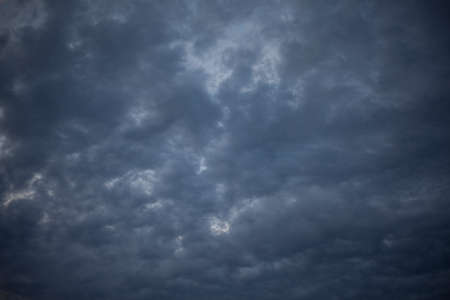 Heavenly landscape. Evening clouds. Beauty of nature. Gloomy sky background. Tragic notes in nature. It gets dark outside.の写真素材