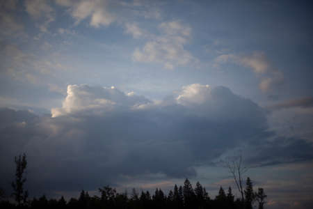 Heavenly landscape. Evening clouds. Beauty of nature. Gloomy sky background. Tragic notes in nature. It gets dark outside.の写真素材