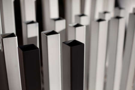 White painted metal. White details of the metal structure. The metal profile dries after being painted.の写真素材