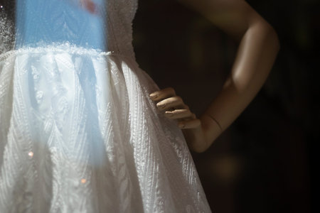 White dress on a mannequin. Lightweight fabric on a female mannequin to showcase outfits. Show of a...