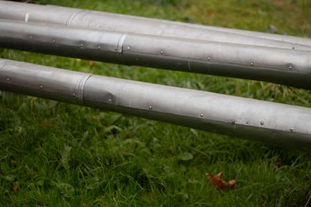 Hot water pipes. Street communications. Steel pipes above the ground.の写真素材