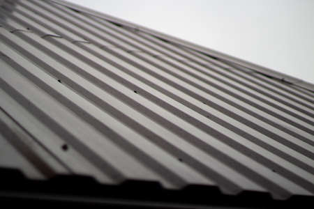 The roof of the house. Roof slope. Residential building roof covering.の写真素材