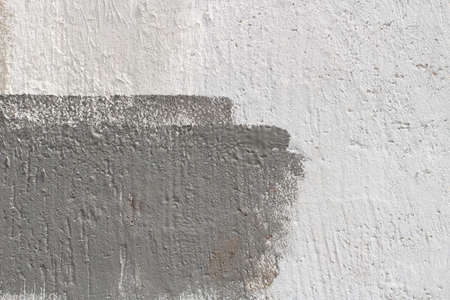 Gray wall. Gray painted wall. Rough concrete wall in different shades of gray. Simple background.の写真素材