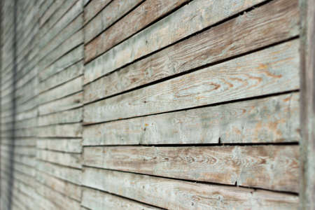 A wall of planks. Painted board texture. Old boardwalk in the street.の写真素材