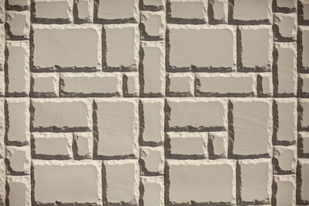Tile texture. The surface of the sidewalk. Tiles in the wall.