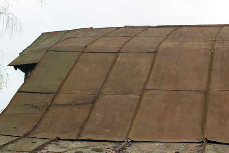 The roof of the house. Roof slope. Residential building roof covering.の写真素材