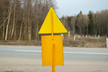 Gas warning yellow sign. Pole in yellow painted metal. Triangular and rectangular signs.の写真素材