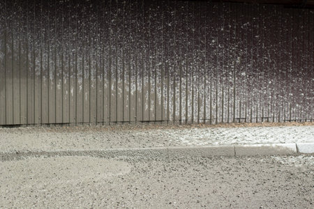 Liquid cement at a construction site. Cement spilled onto the road. The building material is cement and gravel.の写真素材