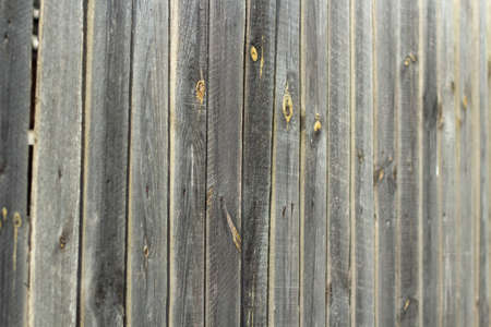 A wall of planks. Painted board texture. Old boardwalk in the street.の写真素材