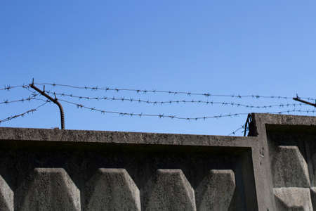 Fenced area. Prison fence. Protection from thieves.の写真素材