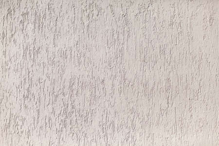 Wall texture. Rough surface. Beige colors in a painted wall.の写真素材